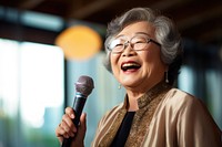Senior microphone glasses smiling. 