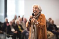 Chubby Senior woman speaker microphone smiling adult. 