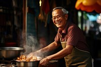 Senior smiling cooking adult. 