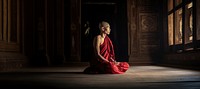 Buddhist monk praying temple light. 