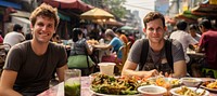 American man eating padthai food restaurant lunch. 