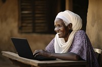 Senior african woman laptop computer sitting. 