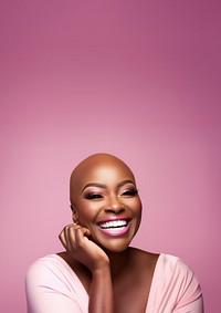 close up face photo of a bald chubby black woman smiling with pink tone makeup.  