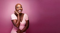 close up face photo of a bald chubby black woman smiling with pink tone makeup.  