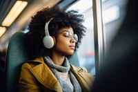 Woman wearing headphone headphones headset train. 