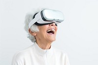 Elder Asian woman using virtual reality headset technology accessories happiness. 