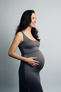 Pregnant happy woman portrait standing dress. 