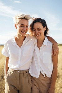 Romantic gay lesbian couple portrait smiling nature. 