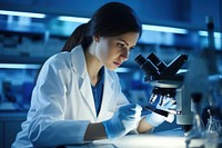 Scientist using microscope female adult biotechnology. AI generated Image by rawpixel.