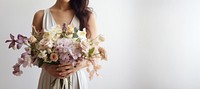 Florist holding beautiful wedding bouquet flower plant petal. 