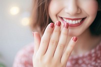 Woman show cute nails painting hand finger smile. 