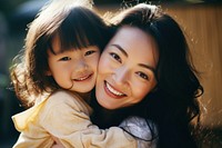 Asian daughter hugging mother adult smile happy. 