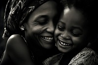 Black daughter hugging mother laughing portrait adult. 