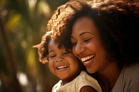 Black daughter hugging mother laughing adult smile. 