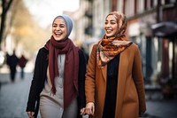 Muslim women laughing smiling walking. 