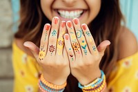 Nails painted hand finger smile. 