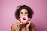 Eating portrait biting donut. 