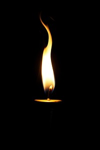 Candle flame black fire black background. AI generated Image by rawpixel.