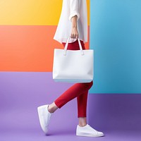 Woman hauling a white tote bag footwear handbag adult. 