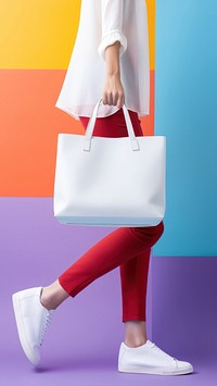 Woman hauling a white tote bag footwear handbag shoe. 