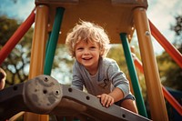 Child playing playground outdoors park. 