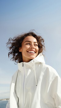 Woman wearing white jacket portrait adult smile. 