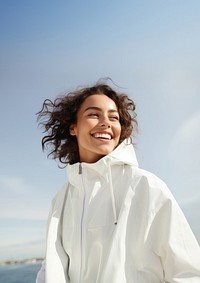 Woman wearing white jacket portrait outdoors adult. 