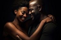 Black couple portrait hugging adult. 