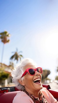 Eldery woman driving sunglasses laughing portrait. AI generated Image by rawpixel.