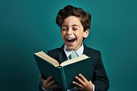 School boy laughing book publication. AI generated Image by rawpixel.