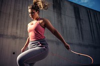 Woman skipping rope sports adult determination. 