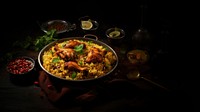 Chicken briyani paella plate food. 