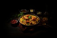 Chicken briyani paella spoon food. 