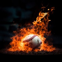 Photo of close up shot of a baseball on fire.  