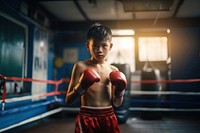 Thai boy practicng muay thai boxing punching sports. AI generated Image by rawpixel.