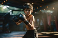 Thai boy practicng muay thai boxing punching sports. AI generated Image by rawpixel.