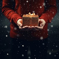 People holding christmas gift illuminated celebration decoration. 