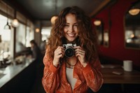 Enjoy woman holding camera portrait adult photo. 