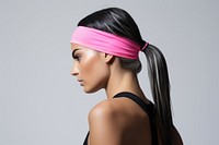 Woman wearing a sport headband sports adult pink. 