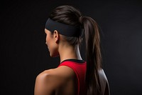 Woman wearing a sport headband ponytail sports determination. 