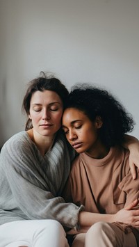 2 women hugging adult togetherness affectionate. 