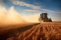 Tractor pulling grain cart field agriculture outdoors. 