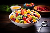 Fresh fruit salad bowl berry table. 