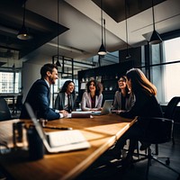 Photo of office workers laughing in the meeting room