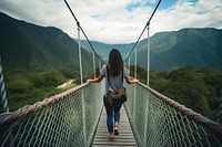 Backpacker woman walking bridge mountain. 