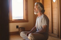 Mature man meditating sitting sports adult. 