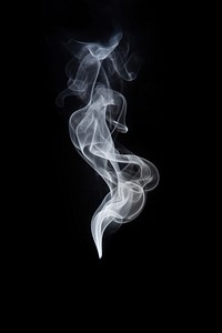 Soft smoke raising black white black background. 