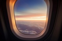 Airplane window porthole sunset sky. AI generated Image by rawpixel.