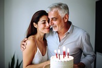 Happy couple mature man cake birthday portrait. 