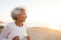 Happy athletic mature woman portrait jogging smile. 